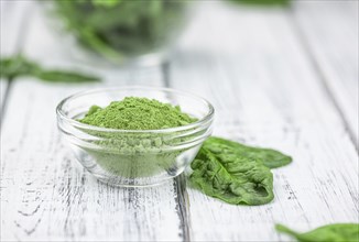 Homemade green spinach powder (close up shot, selective focus)