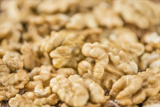 Walnut kernels on a vintage background as detailed close-up shot (selective focus)