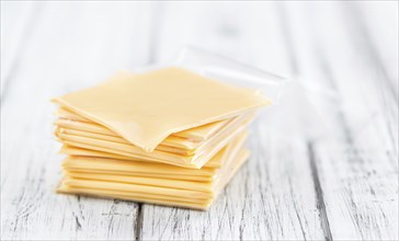 Portion of sliced Cheese (close-up shot, selective focus)