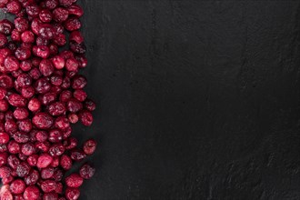 Portion of healthy Dried Cranberries (selective focus, close-up shot)