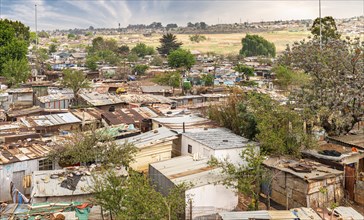 Poor townships next to Johannesburg, South Africa, with a dramatic sky, Africa