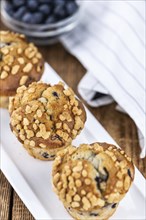 Fresh Blueberry Muffins as detailed close-up shot (selective focus)