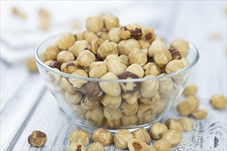 Peeled Hazelnuts as detailed close up shot (selective focus)