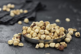 Peeled Hazelnuts as detailed close up shot (selective focus)