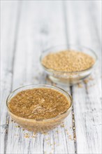 Homemade Sweet Mustard on an wooden table (selective focus) as detailed close-up shot