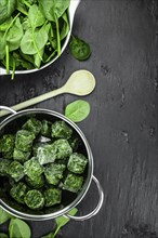 Frozen spinach cubes as detailed close up shot (selective focus)