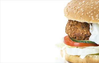 Falafel Burger isolated on white background (close-up shot, selective focus)