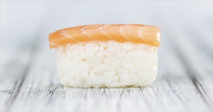 Portion of Sushi on a wooden table (selective focus, close-up shot)