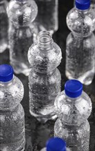 Chilled bottled sparkling water (detailed close up shot, selective focus)