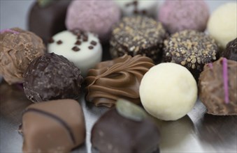 Portion of mixed Pralines as detailed close-up shot