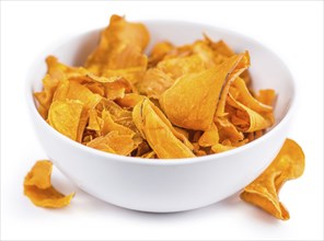 Portion of Sweet Potato Chips as detailed close-up shot isolated on white background