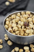 Peeled Hazelnuts as detailed close up shot (selective focus)