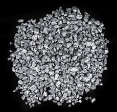 Heap of silver nuggets isolated on black background (close up)