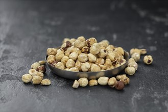 Peeled Hazelnuts as detailed close up shot (selective focus)