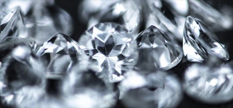 Small Diamonds on dark background as close up shot (selective focus)