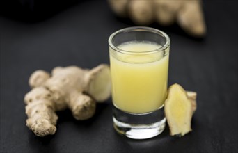 Portion of fresh Ginger Juice (selective focus, close-up shot)