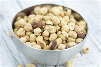 Peeled Hazelnuts as detailed close up shot (selective focus)