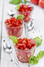 Homemade Cutted Tomatoes on vintage background (selective focus, close-up shot)