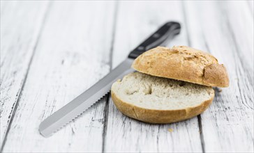 Rolls (German style) on rustic wooden background as close-up shot