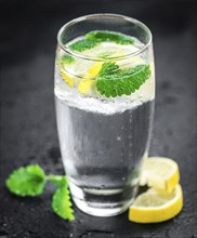 Portion of Lemonade as detailed close up shot on a slate slab (selective focus)