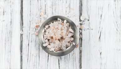 Pink Salt on a vintage background as detailed close-up shot (selective focus)