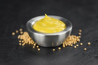 Mustard on a vintage background as detailed close-up shot (selective focus)