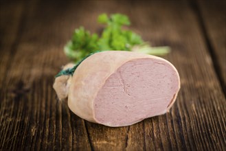 Liverwurst on a vintage background as detailed close-up shot (selective focus)