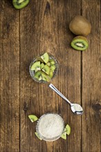 Fresh made Kiwi powder (slective focus, close-up shot) on an old wooden table