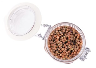 Portion of preserved Pink Peppercorns as detailed close-up shot isolated on white background