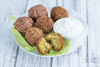 Falafel (close-up shot, selective focus) on an old wooden table