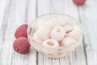 Preserved Lychees on a vintage background as detailed close-up shot (selective focus)