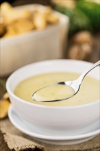 Fresh made Chanterelle Soup on a vintage background as detailed close-up shot