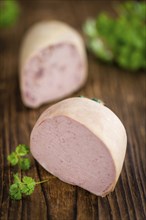 Liverwurst on a vintage background as detailed close-up shot (selective focus)