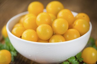 Yellow Tomatoes on a vintage background as detailed close-up shot, selective focus