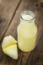 Homemade Honeydew Melon Smoothie on wooden background (selective focus)