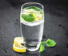 Homemade Lemonade on vintage background (selective focus, close-up shot)