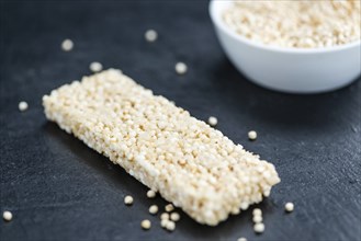 Some Quinoa Bars on a slate slab (close-up shot, selective focus)