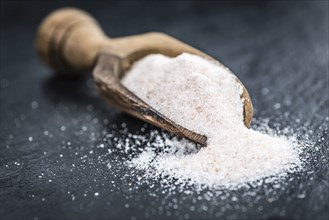 Portion of Himalayan Salt on a rustic slate slab (selective focus, close-up shot)