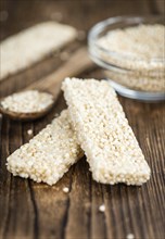 Quinoa Bars on a wooden table as detailed close-up shot (selective focus)