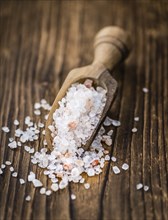 Pink Salt on a vintage background as detailed close-up shot (selective focus)