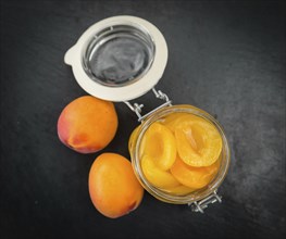 Pickled Apricots on a vintage background as detailed close-up shot (selective focus)