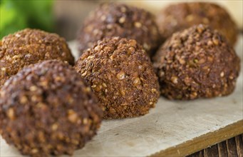 Wooden table with Falafels (close-up shot, selective focus)