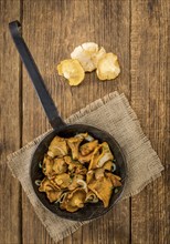 Portion of fresh Fried Chanterelles close-up shot, selective focus