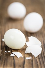 Wooden table with boiled Eggs (selective focus, close-up shot)