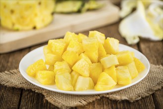 Fresh made Pineapple (sliced) on a vintage background as detailed close-up shot