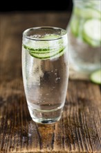 Cucumber Water on a vintage background as detailed close-up shot, selective focus