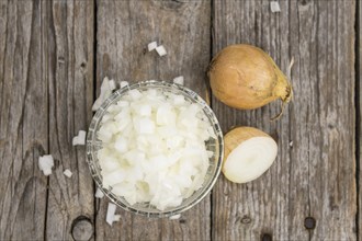 Diced white onions on a vintage background as detailed close-up shot, selective focus