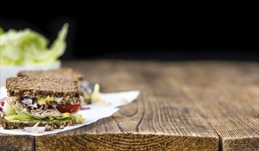 Tuna Sandwich (wholemeal bread, selective focus) on an old wooden table