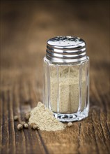 Fresh made White Pepper on a vintage background as detailed close-up shot