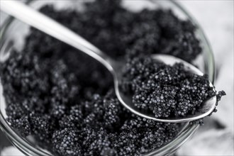 Caviar on a vintage looking slate slab (selective focus)